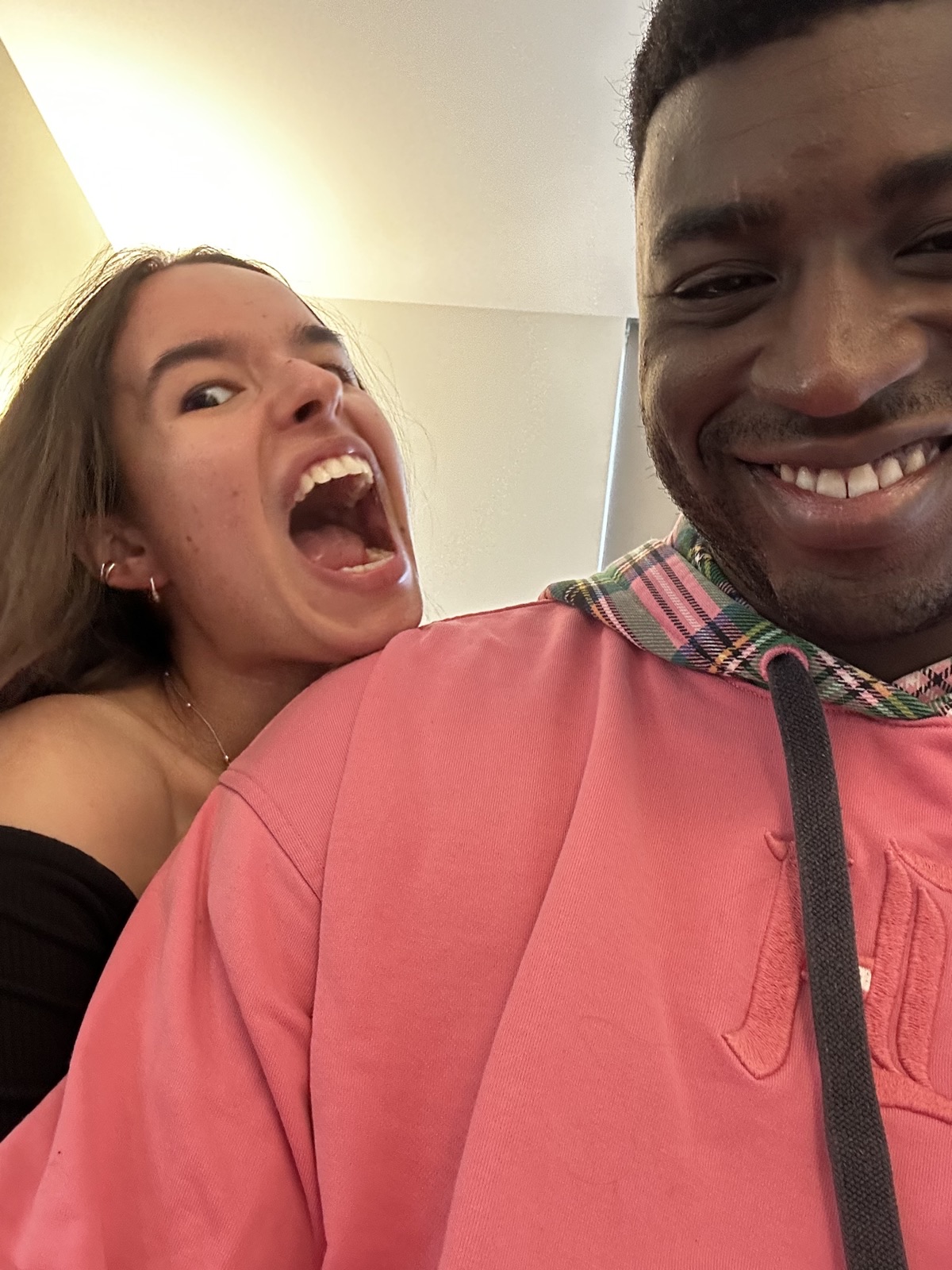 Ioana playfully pretending to bite her partner