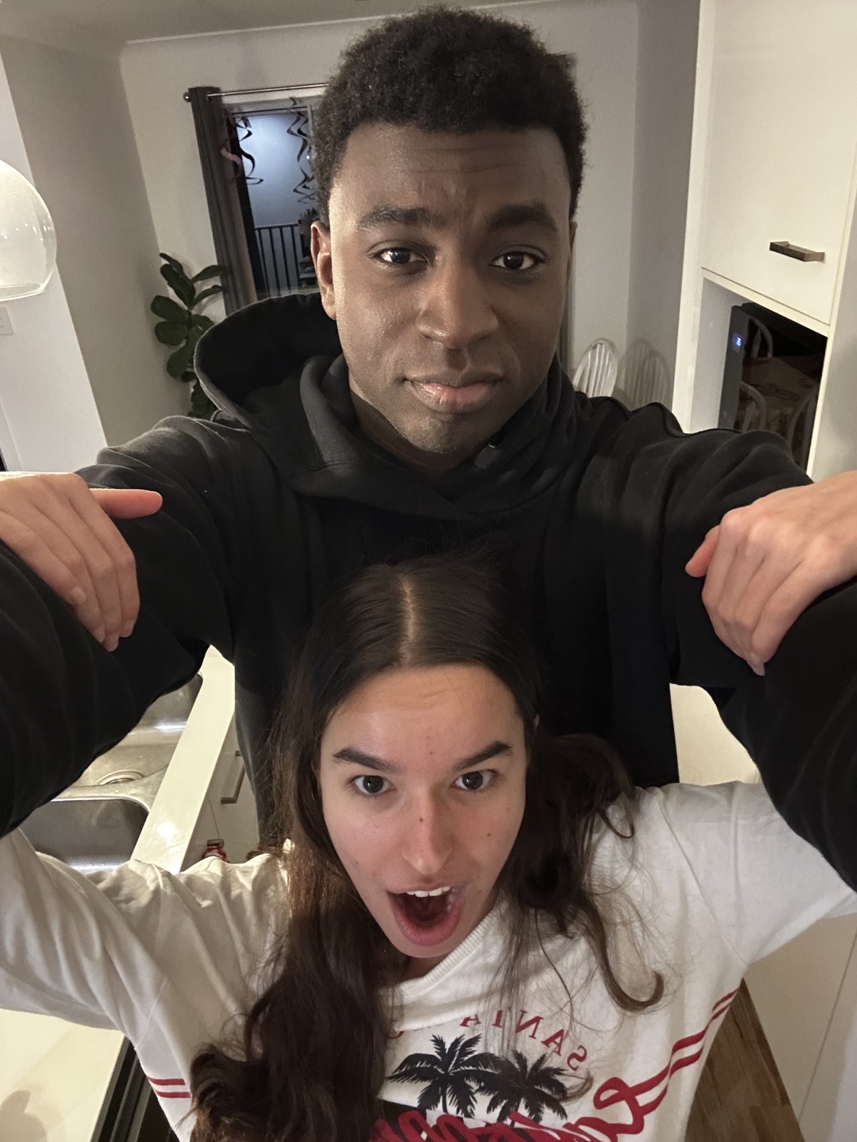 Ioana and her partner making a playful pose together